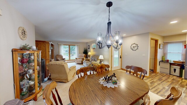 216 1st St, Kiester, MN 56051 - dining space featuring light wood finished floors, recessed lighting, and a chandelier