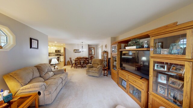 216 1st St, Kiester, MN 56051 - living room with a chandelier and light colored carpet