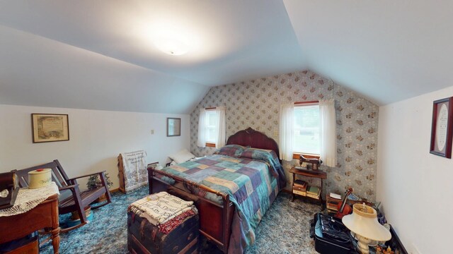 216 1st St, Kiester, MN 56051 - carpeted bedroom with vaulted ceiling and wallpapered walls