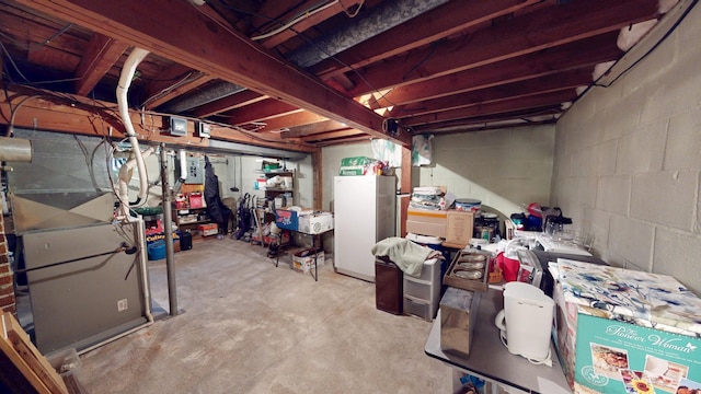 216 1st St, Kiester, MN 56051 - unfinished basement with freestanding refrigerator