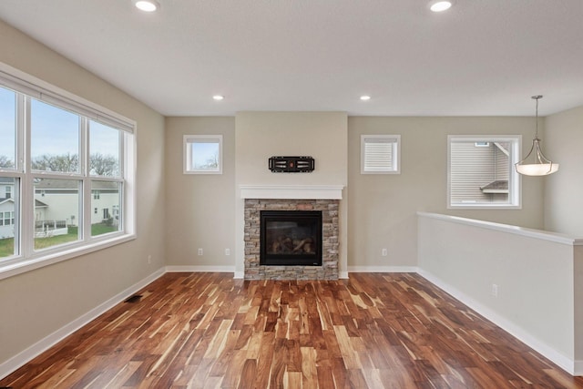 5743 Meridian Way NE, Prior Lake, MN 55372 - unfurnished living room with wood finished floors, a fireplace, and recessed lighting