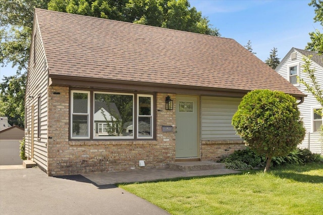422 Jefferson Ave S, Edina, MN 55343 - view of front of property with brick siding, a front lawn, and a shingled roof