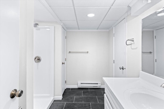 422 Jefferson Ave S, Edina, MN 55343 - bathroom with a baseboard radiator, tile patterned floors, vanity, a paneled ceiling, and a shower