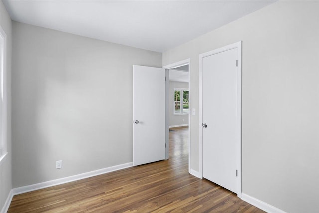 422 Jefferson Ave S, Edina, MN 55343 - unfurnished bedroom featuring wood finished floors and baseboards
