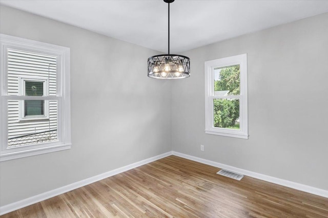 422 Jefferson Ave S, Edina, MN 55343 - empty room featuring a chandelier and light wood-style floors