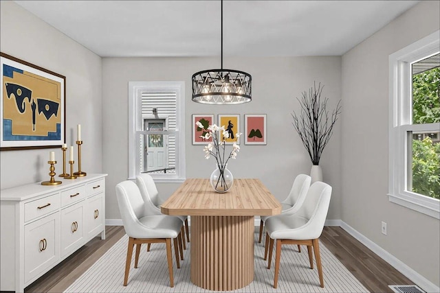 422 Jefferson Ave S, Edina, MN 55343 - dining room featuring dark wood-style flooring and a chandelier