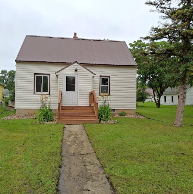 251 Colfax Ave NE, Hector, MN 55342 - view of front of house with a metal roof and a front lawn