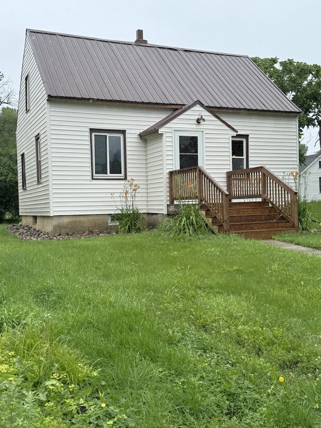 251 Colfax Ave NE, Hector, MN 55342 - back of property with a metal roof and a yard