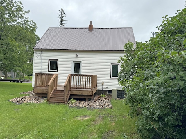251 Colfax Ave NE, Hector, MN 55342 - back of house with a deck, a yard, and a metal roof