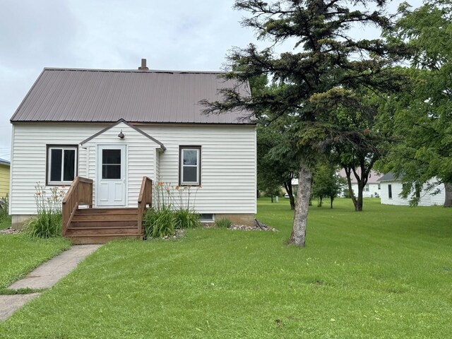 251 Colfax Ave NE, Hector, MN 55342 - view of front of house with a front lawn and a metal roof