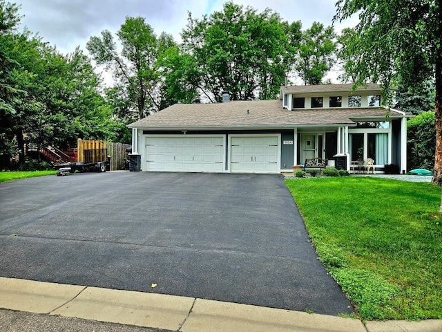 904 155th St, Burnsville, MN 55306 - view of front of house with a garage, driveway, and a porch