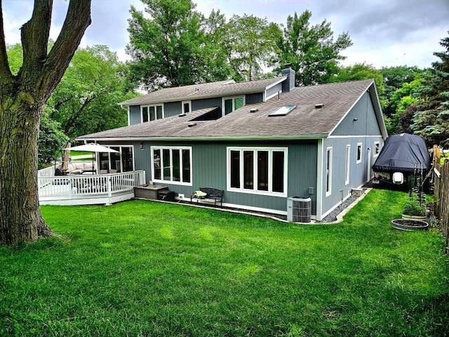 904 155th St, Burnsville, MN 55306 - rear view of property with a chimney, a deck, a lawn, and roof with shingles