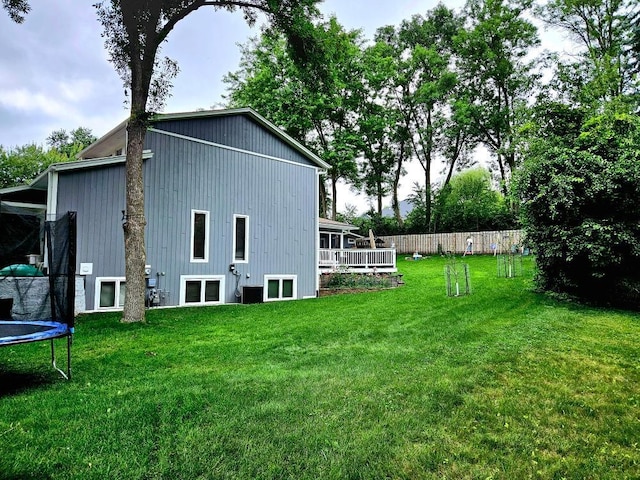 904 155th St, Burnsville, MN 55306 - rear view of property featuring a trampoline