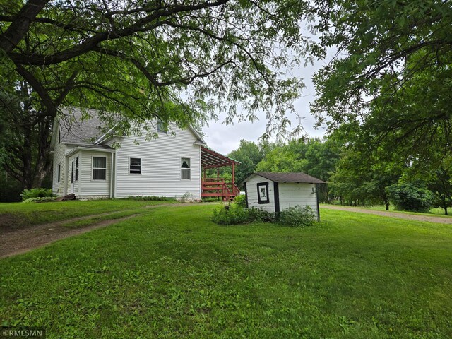 1264 389th Ave NE, Stanchfield Twp, MN 55080 - view of green lawn with a storage shed