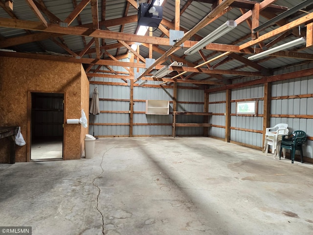 1264 389th Ave NE, Stanchfield Twp, MN 55080 - garage featuring a garage door opener and metal wall