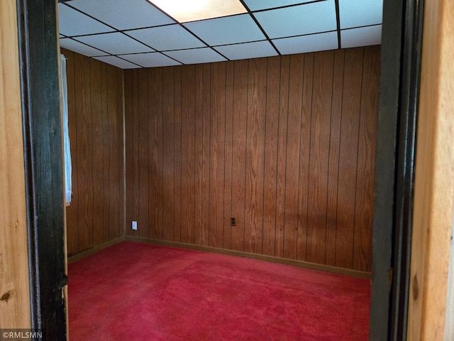 1264 389th Ave NE, Stanchfield Twp, MN 55080 - carpeted empty room with a drop ceiling and wooden walls
