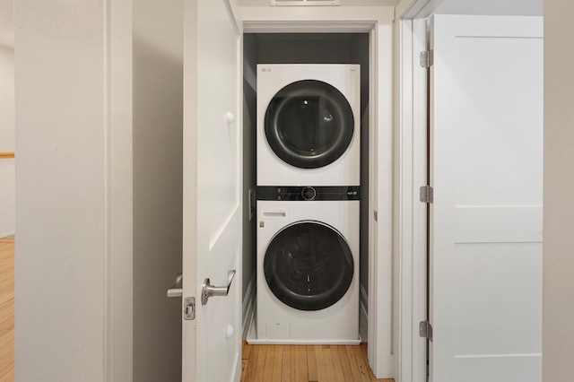730 13th Ave S, Saint Cloud, MN 56301 - laundry room with stacked washer and clothes dryer and wood finished floors