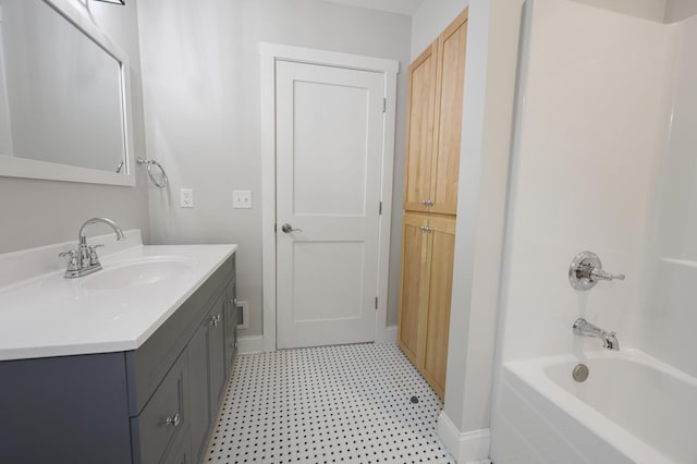 730 13th Ave S, Saint Cloud, MN 56301 - full bath featuring tile patterned floors, vanity, and washtub / shower combination
