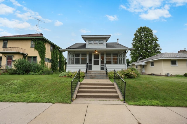 730 13th Ave S, Saint Cloud, MN 56301 - view of front of property with a sunroom and a front lawn