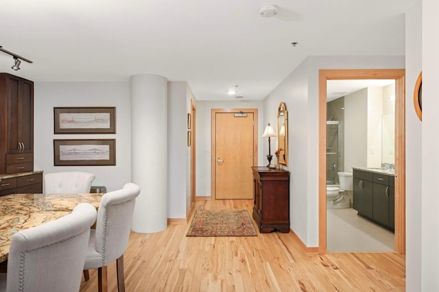 1120 2nd St Unit 1002, Minneapolis, MN 55415 - corridor featuring light wood finished floors and rail lighting