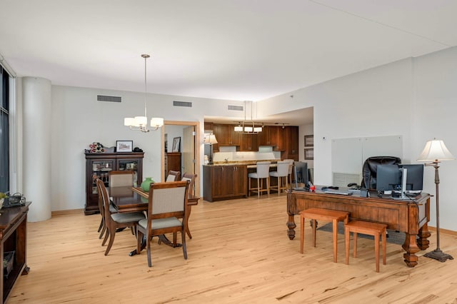 1120 2nd St Unit 1002, Minneapolis, MN 55415 - dining room featuring a chandelier, light wood-type flooring, and an office area