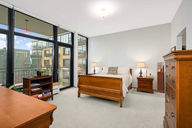 1120 2nd St Unit 1002, Minneapolis, MN 55415 - carpeted bedroom featuring access to exterior and floor to ceiling windows