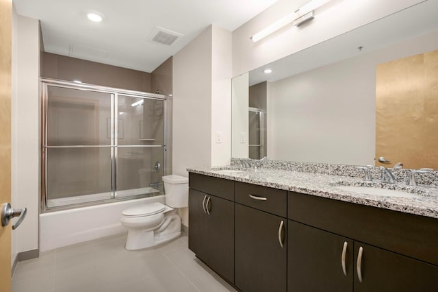 1120 2nd St Unit 1002, Minneapolis, MN 55415 - full bath featuring double vanity, bath / shower combo with glass door, tile patterned flooring, and recessed lighting