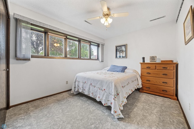 611 4th St NE, Dilworth, MN 56529 - bedroom with carpet, a textured ceiling, and ceiling fan