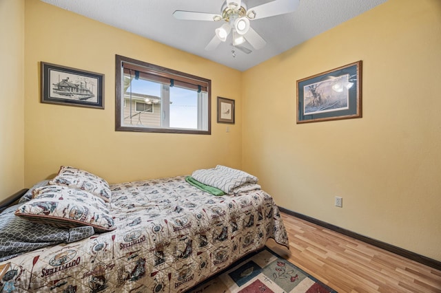 611 4th St NE, Dilworth, MN 56529 - bedroom featuring wood finished floors and a ceiling fan