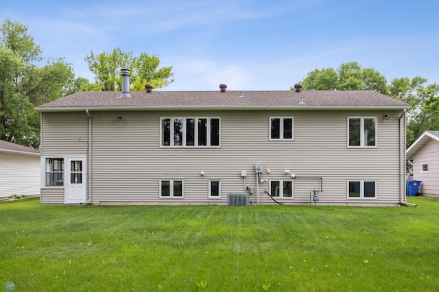 611 4th St NE, Dilworth, MN 56529 - back of property with a yard and a shingled roof