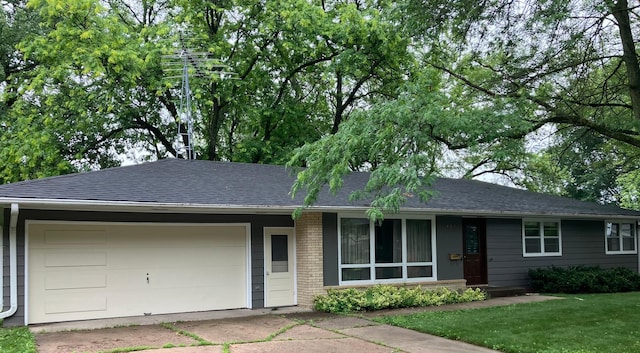 1927 Twin Bluff Rd, Red Wing, MN 55066 - single story home with an attached garage, brick siding, concrete driveway, roof with shingles, and a front yard