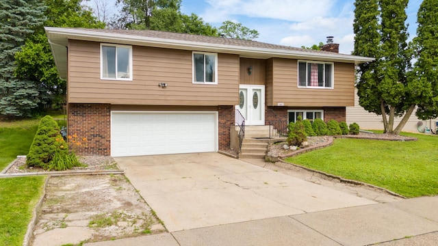 2735 Chisholm Ave N, Saint Paul, MN 55109 - split foyer home featuring brick siding, an attached garage, a chimney, a front lawn, and driveway