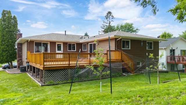 2735 Chisholm Ave N, Saint Paul, MN 55109 - back of property featuring a wooden deck, a lawn, and a chimney