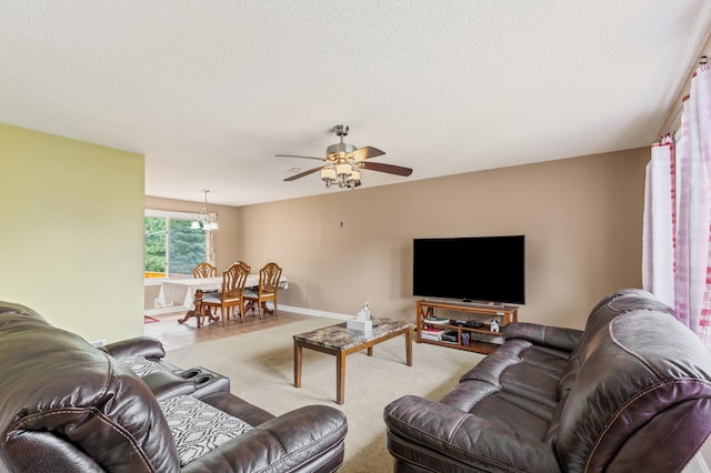 2735 Chisholm Ave N, Saint Paul, MN 55109 - carpeted living room featuring ceiling fan and a textured ceiling