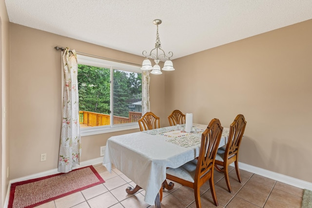 2735 Chisholm Ave N, Saint Paul, MN 55109 - dining room with a chandelier, light tile patterned floors, and a textured ceiling
