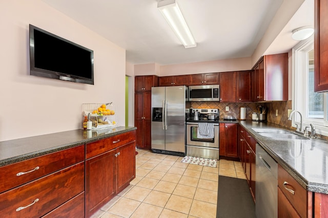 2735 Chisholm Ave N, Saint Paul, MN 55109 - kitchen featuring stainless steel appliances, reddish brown cabinets, decorative backsplash, and light tile patterned flooring