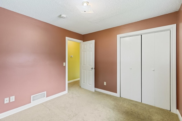 2735 Chisholm Ave N, Saint Paul, MN 55109 - unfurnished bedroom with carpet floors, a closet, and a textured ceiling