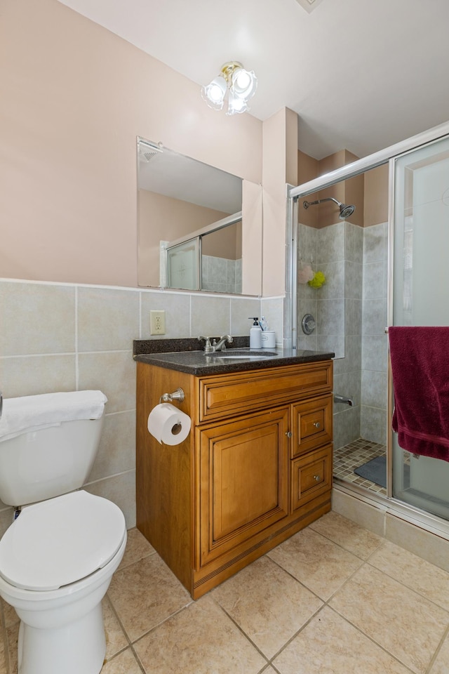 2735 Chisholm Ave N, Saint Paul, MN 55109 - full bath with tile patterned flooring, vanity, tile walls, and a shower stall