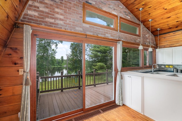 6618 Sumac Dr, Grand Lake Twp, MN 55803 - doorway featuring a water view, light wood-type flooring, high vaulted ceiling, healthy amount of natural light, and wood ceiling