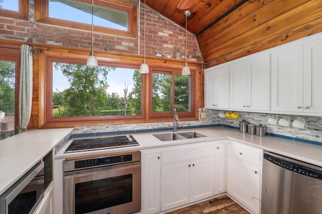 6618 Sumac Dr, Grand Lake Twp, MN 55803 - kitchen featuring appliances with stainless steel finishes, vaulted ceiling, wood ceiling, light countertops, and tasteful backsplash