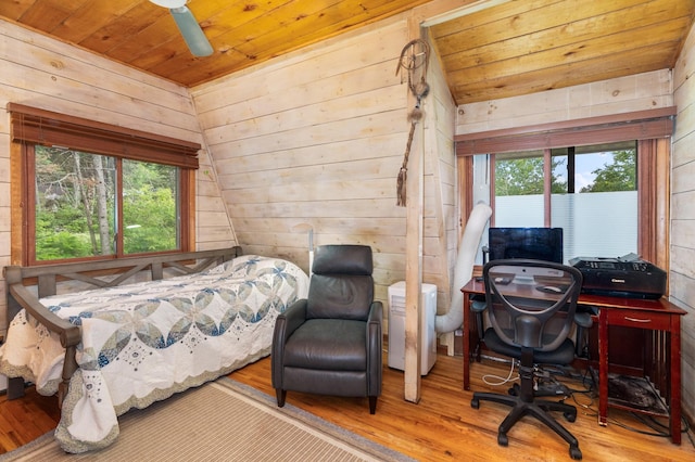 6618 Sumac Dr, Grand Lake Twp, MN 55803 - bedroom with wood finished floors, wood walls, wood ceiling, and a desk