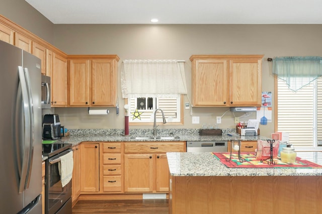 9775 Olive St NW, Coon Rapids, MN 55433 - kitchen featuring appliances with stainless steel finishes, dark wood-style floors, light brown cabinets, light stone counters, and recessed lighting