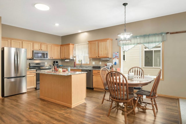 9775 Olive St NW, Coon Rapids, MN 55433 - kitchen with stainless steel appliances, light brown cabinets, a center island, dark wood-type flooring, and recessed lighting