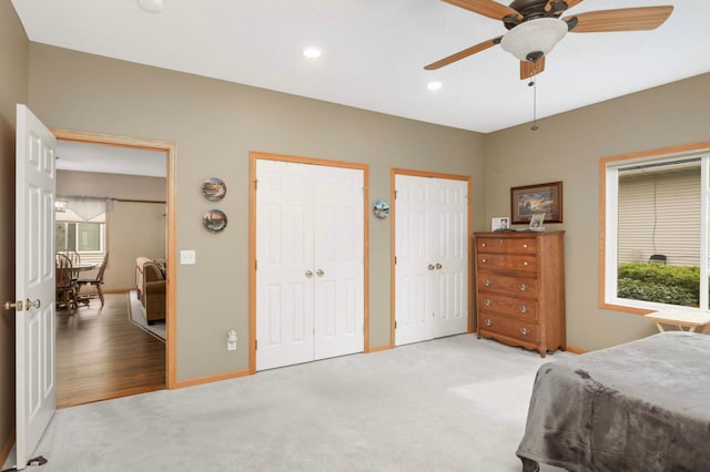 9775 Olive St NW, Coon Rapids, MN 55433 - bedroom with two closets, light carpet, recessed lighting, and a ceiling fan