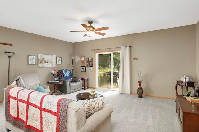 9775 Olive St NW, Coon Rapids, MN 55433 - carpeted living area with a ceiling fan and baseboards