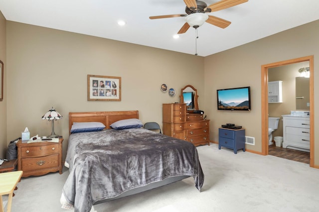 9775 Olive St NW, Coon Rapids, MN 55433 - carpeted bedroom with ensuite bath, recessed lighting, and ceiling fan