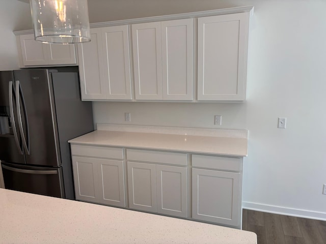 1719 Hauer Trl, Shakopee, MN 55379 - kitchen with stainless steel fridge with ice dispenser, light countertops, dark wood finished floors, a chandelier, and decorative light fixtures