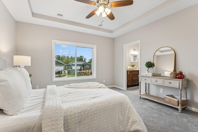 4838 Education Dr N, Hugo, MN 55038 - bedroom featuring light carpet, ensuite bath, ceiling fan, and a tray ceiling