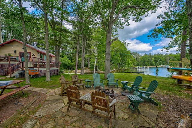 10399 Sandy Beach Rd, Round Lake Twp, WI 54843 - view of patio with a fire pit, a deck with water view, and stairway