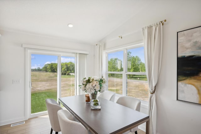 26645 8th St W, Zimmerman, MN 55398 - dining space featuring vaulted ceiling and light wood-style floors